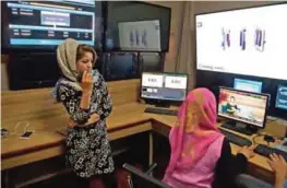  ??  ?? Afghan staff of Zan TV (Women’s TV) work in an editing room in Kabul.— AFP photos