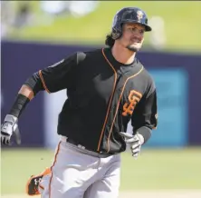  ?? Carlos Osorio / Associated Press ?? The Giants’ Jarrett Parker is shown after hitting a solo homer against Milwaukee last month, one of two he’s had this spring.