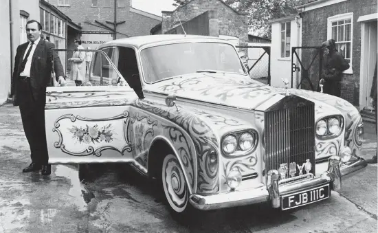  ?? GETTY ?? Chauffeur Les Anthony beside John Lennon’s psychedeli­c RollsRoyce in 1967.