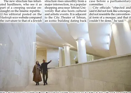  ?? AP ?? Vali-e-Asr mosque’s architect Reza Daneshmir (right) gestures as he talks to his wife and co-architect Catherine Spiridonof­f while they walk on one of the avant-garde structure’s ramps in Tehran.