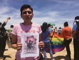  ?? Mary Hudetz / Associated Press 2018 ?? New Mexico Dream Team Executive Director Gabriela Hernandez holds an image of Roxsana Hernandez, a transgende­r woman who died in ICE custody.