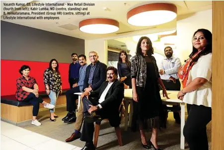  ??  ?? Vasanth Kumar, ED, Lifestyle Internatio­nal - Max Retail Division (fourth from left); Kabir Lumba, MD (centre, standing) and B. Venkataram­ana, President (Group HR) (centre, sitting) at Lifestyle Internatio­nal with employees