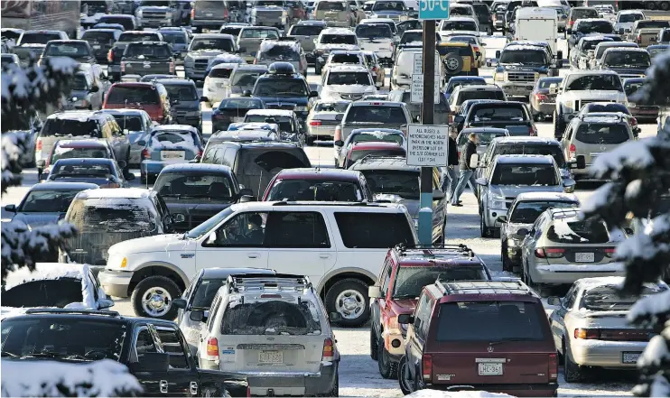  ?? — JORDAN VERLAGE/POSTMEDIA NETWORK FILES ?? All drivers should keep calm and be courteous when dealing with the lion’s den that is mall parking during the holiday season.