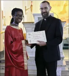  ??  ?? Emily Duggan with Fr Maciej. Right: Senior Best Mass Attendance winner Josephine Ogbanga with Fr Maciej