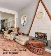  ?? ?? The unusual ‘mountain peak’ fireplace