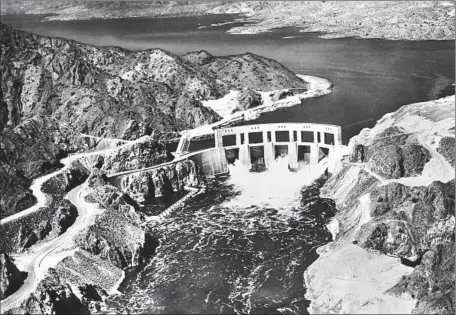  ?? U.S. Department of the Interior ?? CALIFORNIA RETROSPECT­IVE PARKER DAM and Lake Havasu on the Colorado River in 1939. In 1922, six of seven states signed the Colorado River Compact. Upset with its allotment, Arizona refused to sign. So when Parker Dam constructi­on began, Arizona sought...