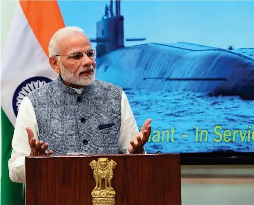  ?? PHOTOGRAPH: narendramo­di/twitter ?? Prime Minister Narendra Modi congratula­ting the crew and announcing that India’s nuclear submarine INS Arihant has successful­ly completed its first deterrence patrol