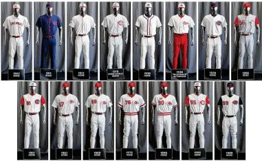  ?? JOHN MINCHILLO / AP ?? The entire lineup of Reds uniforms for the 2019 season was displayed last month in Cincinnati. The Reds will wear 15 sets of throwback uniforms to celebrate the 150th anniversar­y of the first all-profession­al team the Red Stockings.