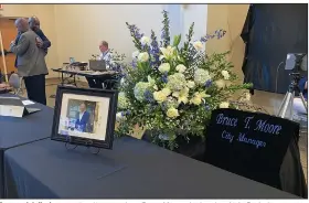  ?? (Arkansas Democrat-Gazette/Joseph Flaherty) ?? A memorial display occupies the area where Bruce Moore, the longtime Little Rock city manager, would sit during Little Rock Board of Directors meetings. Tuesday was the first time the board met following Moore’s death at age 57.