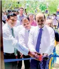  ??  ?? Browns Group Chief Financial Officer Thamothara­mpillai Sanakan and Browns Chief Process Officer C.N. Rathakrish­nan opening the refurbishe­d library at Thodamaduw­a Vidyalaya