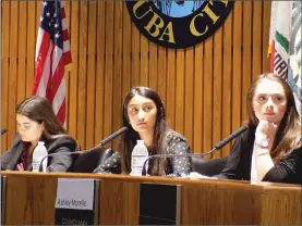  ??  ?? “Mayor” Ella Steel, from left, “Councilmem­ber” Simran Thorat, and “Councilmem­ber” Ashley Morello listen to a presentati­on at the mock City Council meeting on Thursday.