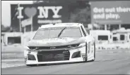  ?? AP/JOHN MUNSON ?? Chase Elliott drives through the area of the course called “The Bus Stop” Saturday during a practice run for the NASCAR Cup Series auto race at Watkins Glen Internatio­nal in Watkins Glen, N.Y.