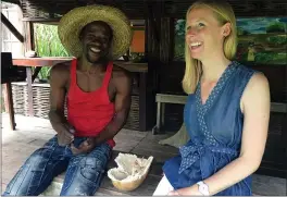  ?? PRNEWSFOTO ?? Darley Newman, right, tries local food with Gilbert Larose during the filming of “Martinique Caribbean Culture” on “Travels with Darley” on Amazon Prime Video.