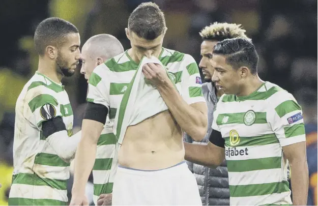  ??  ?? Celtic defender Jozo Simunovic shows his frustratio­n as he and his team-mates walk off after their 2-0 home defeat by Valencia in the Europa League round of 32 first leg.