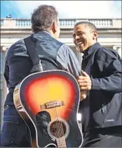  ?? Chip Somodevill­a Getty Images ?? BRUCE SPRINGSTEE­N, left, greets President Obama at a Madison, Wis., rally in the 2012 campaign.
