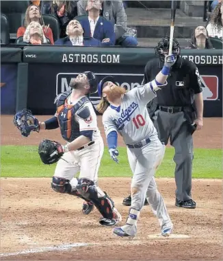  ?? Robert Gauthier Los Angeles Times ?? THINGS WEREN’T LOOKING UP for the Dodgers when Justin Turner popped out in the eighth inning. Houston catcher Brian McCann made the play in foul territory for the second out.