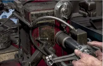  ??  ?? Above: Honing a con rod big end; below: Grinding journals on a crankshaft