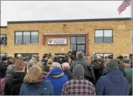  ?? NICHOLAS BUONANNO — NBUONANNO@TROYRECORD.COM ?? A large crowd gathers around North Greenbush Police Chief Robert Durivage as he greets everyone during his retirement walk-out ceremony at the police station Friday.