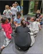  ?? Rome Little Theatre ?? Director Maegan Williams chats with the cast of “Annie, Jr.” at rehearsals for the show which opens June 8 at the Rome City Auditorium.