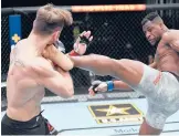  ?? JEFF BOTTARI/ZUFFA LLC ?? Francis Ngannou, right, kicks Stipe Miocic in their UFC heavyweigh­t championsh­ip fight on Saturday at UFC APEX in Las Vegas, Nevada.