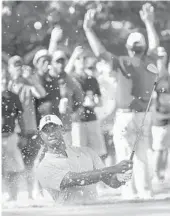  ?? JOHN AMIS/AP ?? Tiger Woods hits up to the 13th green during the second round of the Tour Championsh­ip golf tournament Friday.