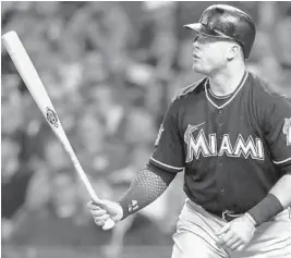  ?? AARON DOSTER/AP ?? The Marlins Justin Bour is walking in 18.2 percent of his plate appearance­s, more than double the league average of 8.8 percent.