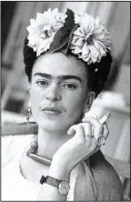  ?? Courtesy Throckmort­on Fine Art, New York ?? Frida Kahlo poses for Nickolas Muray in 1941. The photo is titled Frida with Cigarette.