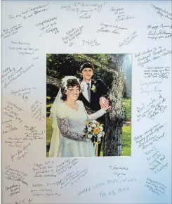  ?? JULIE JOCSAK THE ST. CATHARINES STANDARD ?? On their wedding day. The autographe­d frame was given to them on their 30th anniversar­y last year.