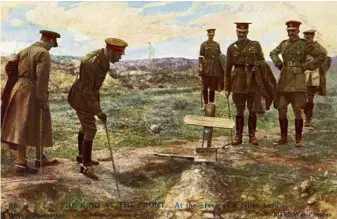  ??  ?? George V on the Western Front visiting the grave of a fallen hero during World War I