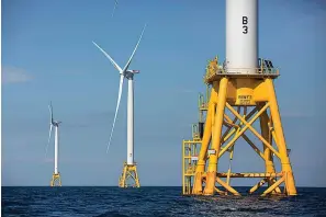  ?? The Associated Press ?? This photo from Aug. 15, 2016, shows offshore wind turbines near Block Island, R.I. The Biden administra­tion said Wednesday it will hold its first offshore wind auction next month, offering nearly 500,000 acres off the coast of New York and New Jersey for wind energy projects that could produce enough electricit­y to power nearly 2 million homes.