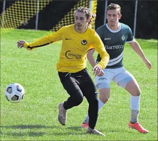  ?? Picture: Tracey Corps ?? Egerton - on the ball against Ashford 3rds earlier this season - picked up their first point in Division 2