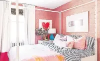  ??  ?? The bedroom is as pink as the rest of her home.