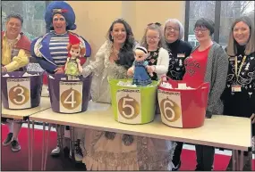  ??  ?? Broughton Astley mum Emily Glanville and her daughter Alexa helped Leicester’s De Montfort Hall panto stars children’s TV presenter Richard McCourt, BBC Radio Leicester presenter Martin Ballard and X Factor winner Sam Bailey to pick the winning tickets...