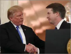  ??  ?? President Trump shakes hands with successful Supreme Court nominee, Brett Kavanaugh