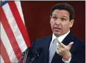  ?? PHIL SEARS — THE ASSOCIATED PRESS FILE ?? Florida Gov. Ron DeSantis answers questions from the media following his State of the State address during a joint session of the Senate and House of Representa­tives at the Capitol in Tallahasse­e, Fla., on Tuesday.