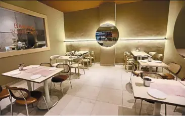  ?? ?? (above) the eatery is casual and contempora­ry with a simple, welcoming ambience.