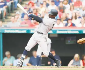  ?? David Maxwell / Getty Images ?? The Yankees’ Didi Gregorius hits a three- run home run against the Indians in the first inning Saturday.