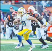  ?? Michael Conroy The Associated Press ?? Los Angeles QB Justin Herbert threw for 317 yards and three touchdowns as the Chargers improved to 7-5.