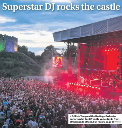  ?? Orchard ?? > DJ Pete Tong and the Heritage Orchestra performed at Cardiff castle yesterday in front of thousands of fans. Full review page 39