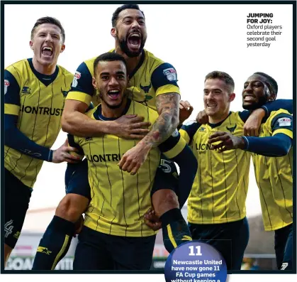  ??  ?? JUMPING FOR JOY: Oxford players celebrate their second goal yesterday