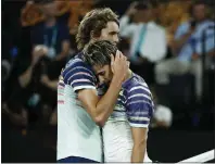  ??  ?? Dominic Thiem, right, is comforted by Alexander Zverev after the latter came out on top when the players last met at the Australian Open