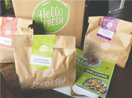  ??  ?? Hello Fresh meal kits are not terribly difficult, Mike Boone says, and each shipment includes large, beautifull­y illustrate­d step-by-step instructio­n cards.