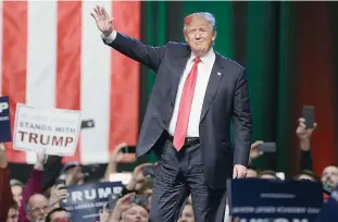  ??  ?? GRAND RAPIDS: Republican presidenti­al candidate businessma­n Donald Trump acknowledg­es the crowd before addressing supporters at a campaign rally. —AP