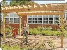  ??  ?? Eagle Scout Troy Smith beneath the pergola he built.