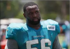  ?? WILFREDO LEE - THE ASSOCIATED PRESS ?? FILE - In this July 30, 2019, file photo, Miami Dolphins defensive tackle Davon Godchaux walks off the field after the teams NFL football training camp in Davie, Fla.