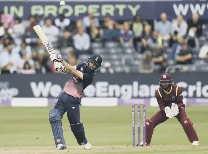  ??  ?? 2 Moeen Ali hits out on his way to making 102 as West Indies wicketkeep­er Shai Hope looks on during the third Royal London One-day Internatio­nal in Bristol.