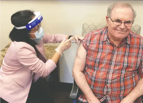  ?? ALBERTA HEALTH SERVICES ?? Mario Saraceni became the first long-term care resident in Calgary to receive the Moderna vaccine on Wednesday.