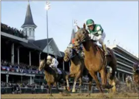  ?? DARRON CUMMINGS — THE ASSOCIATED PRESS ?? Joel Rosario rides Accelerate to victory in the Breeders’ Cup Classic at Churchill Downs, Saturday in Louisville, Ky.