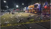  ?? DAVID GRUNFELD — THE ASSOCIATED PRESS ?? Police work at the scene of a shooting at the Krewe of Bacchus Mardi Gras parade Sunday in New Orleans.