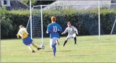  ?? 01_B37final14 ?? James Currie is poised to slot his solo effort into the Brodick goal.